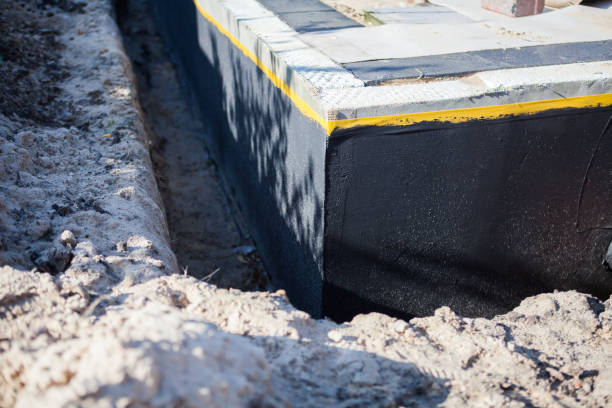 Professional Basement Waterproofing technician working in Riverton, IL